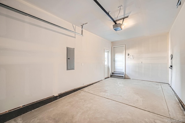 garage featuring a garage door opener and electric panel