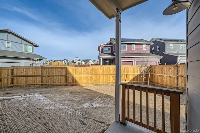 view of yard with a residential view and a fenced backyard