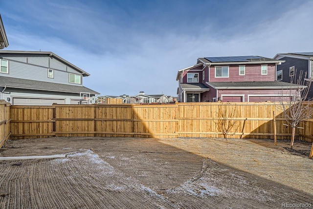 view of yard with a residential view and a fenced backyard