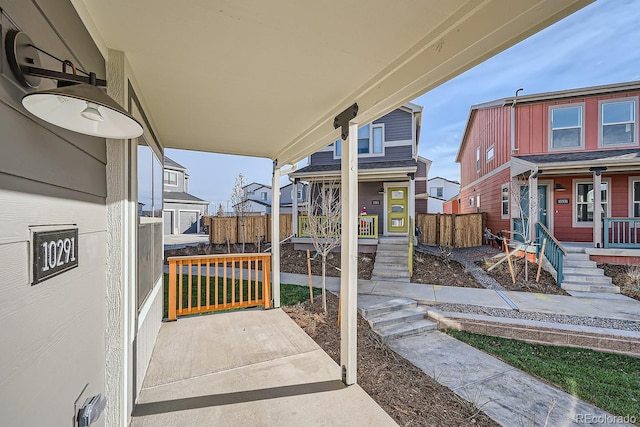 view of patio / terrace with covered porch and fence