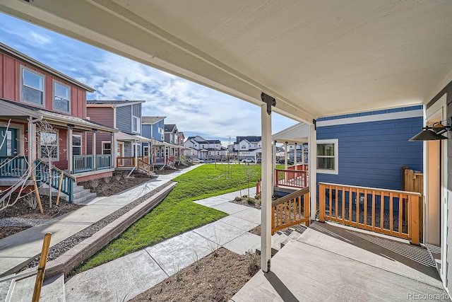 view of patio with a residential view and a porch