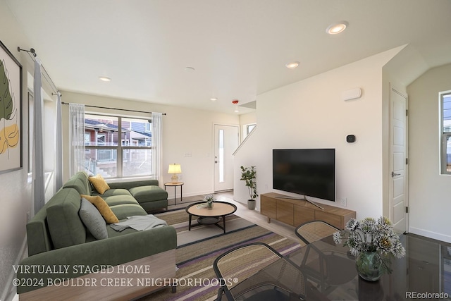 living room with recessed lighting and baseboards