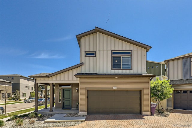 19118 E 54th Pl, Denver, CO 80249 - townhome / multi-family property featuring a garage and decorative driveway