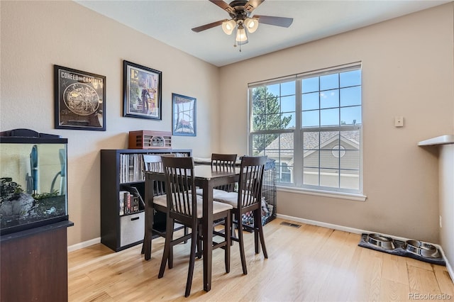 dining space featuring ceiling fan and light hardwood / wood-style flooring