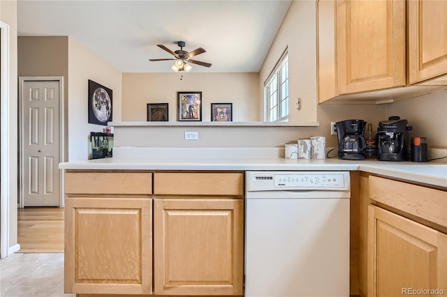 kitchen with light tile patterned floors, white dishwasher, light brown cabinets, kitchen peninsula, and ceiling fan