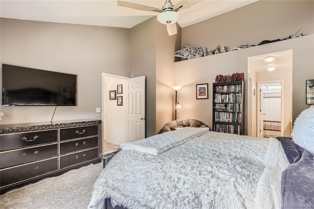 bedroom featuring ensuite bath, ceiling fan, and carpet flooring