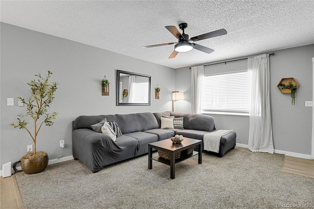 2185 Ambleside Dr, Colorado Springs, CO 80915 - living room featuring a textured ceiling, ceiling fan, wood finished floors, and baseboards