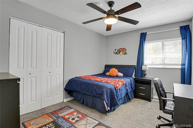 2185 Ambleside Dr, Colorado Springs, CO 80915 - carpeted bedroom with a textured ceiling, a closet, a desk, and ceiling fan