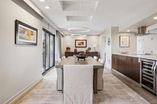 460 S Marion Pkwy Unit 1856, Denver, CO 80209 - dining space featuring beverage cooler, recessed lighting, and light wood finished floors