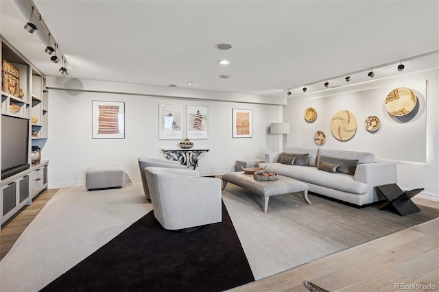 460 S Marion Pkwy Unit 1856, Denver, CO 80209 - living area with rail lighting and light wood-style floors