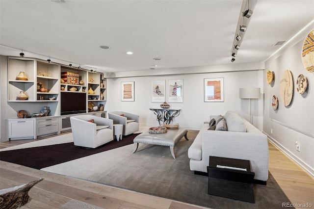 460 S Marion Pkwy Unit 1856, Denver, CO 80209 - living room featuring rail lighting and light wood-style flooring