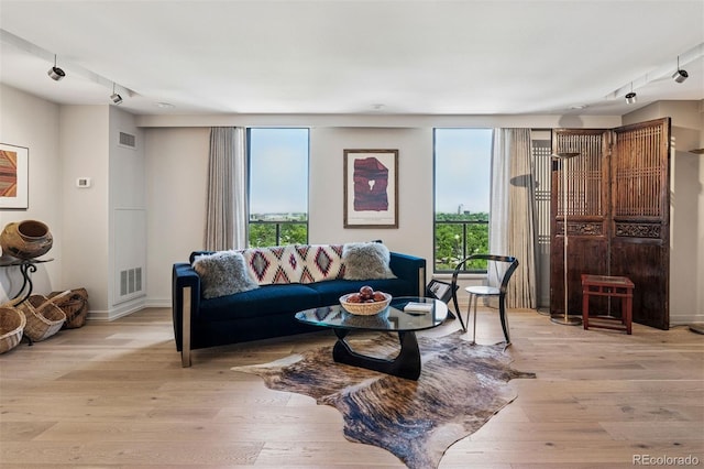 460 S Marion Pkwy Unit 1856, Denver, CO 80209 - living area with light wood finished floors and track lighting