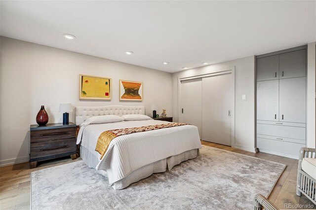 460 S Marion Pkwy Unit 1856, Denver, CO 80209 - bedroom with light wood finished floors and recessed lighting