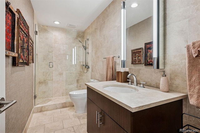 460 S Marion Pkwy Unit 1856, Denver, CO 80209 - full bathroom with tile walls, vanity, a shower stall, tile patterned flooring, and recessed lighting