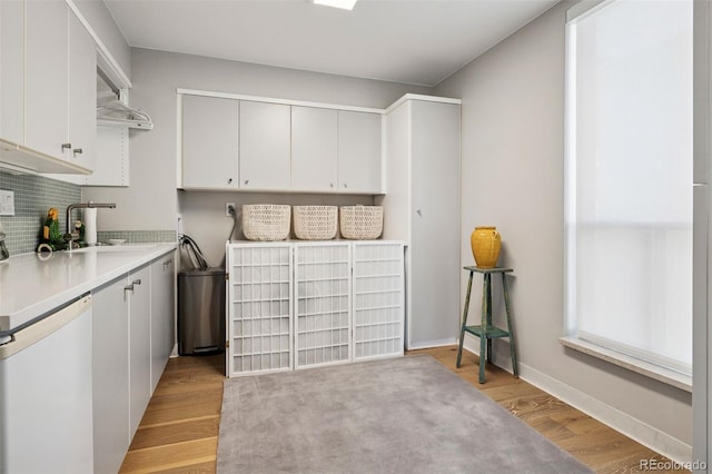 460 S Marion Pkwy Unit 1856, Denver, CO 80209 - washroom featuring light wood finished floors and a sink
