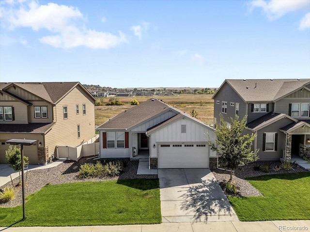 view of front of home with a garage and a front lawn