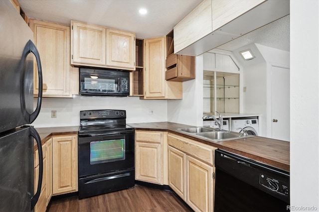 kitchen with sink, vaulted ceiling, light brown cabinets, dark hardwood / wood-style floors, and black appliances