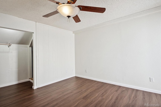 spare room with ceiling fan, dark hardwood / wood-style flooring, and a textured ceiling