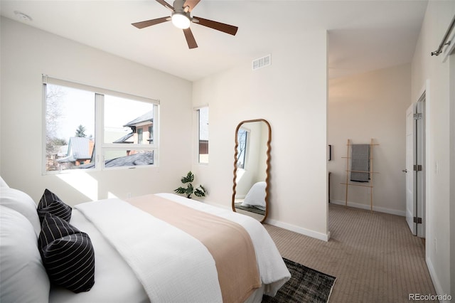 bedroom featuring visible vents, ceiling fan, baseboards, and carpet floors