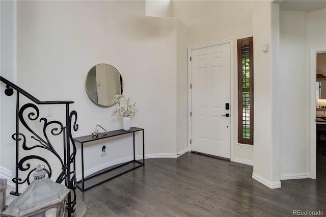 10609 Chadsworth Ln, Highlands Ranch, CO 80126 - foyer entrance featuring dark wood-style flooring and baseboards