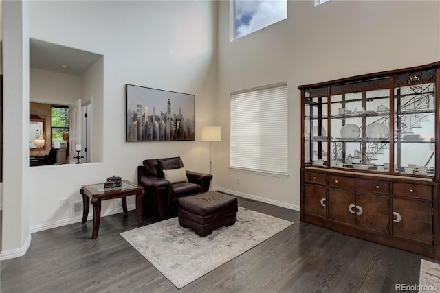 10609 Chadsworth Ln, Highlands Ranch, CO 80126 - sitting room with dark wood-style floors, baseboards, and a high ceiling