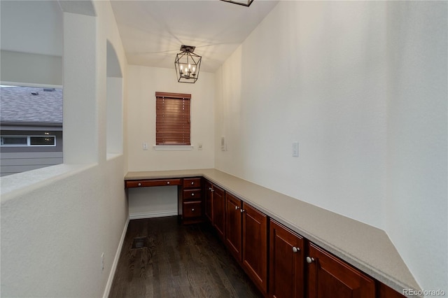 10609 Chadsworth Ln, Highlands Ranch, CO 80126 - unfurnished office featuring dark wood-type flooring, a chandelier, and baseboards