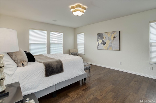 10609 Chadsworth Ln, Highlands Ranch, CO 80126 - bedroom featuring dark wood-style floors and baseboards