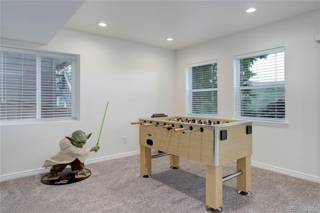 10609 Chadsworth Ln, Highlands Ranch, CO 80126 - rec room with light colored carpet, baseboards, and recessed lighting