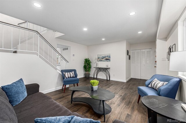 living room with dark hardwood / wood-style flooring