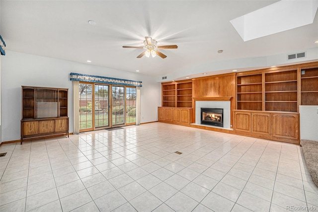 unfurnished living room featuring ceiling fan, visible vents, a warm lit fireplace, recessed lighting, and light tile patterned flooring
