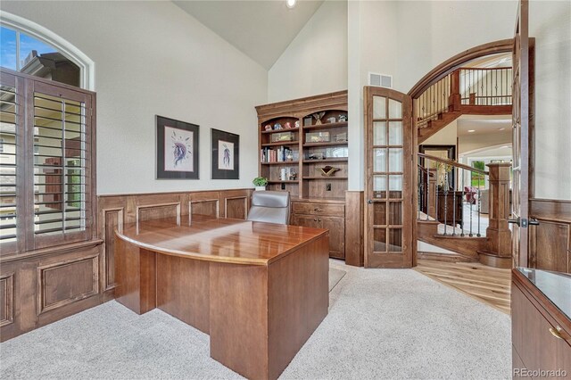 9121 Sunshine Meadow Pl, Parker, CO 80134 - office area with high vaulted ceiling, carpet flooring, and a wainscoted wall