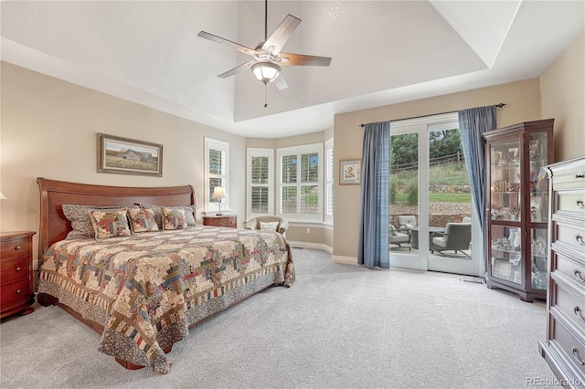 9121 Sunshine Meadow Pl, Parker, CO 80134 - carpeted bedroom featuring access to outside, baseboards, a raised ceiling, and a ceiling fan