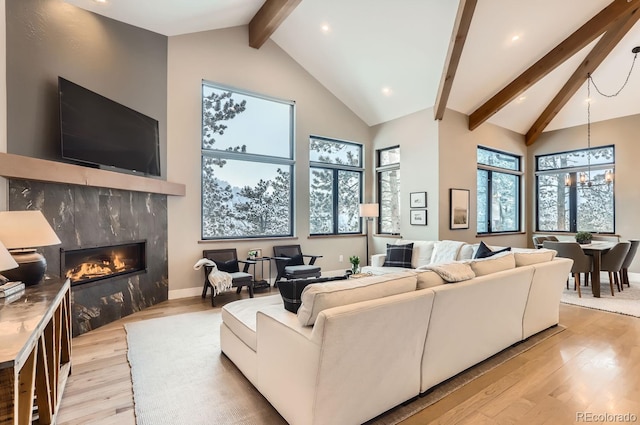 795 Pine Brook Rd, Boulder, CO 80304 - living area featuring light wood-type flooring, beam ceiling, a high end fireplace, a chandelier, and recessed lighting