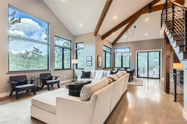 795 Pine Brook Rd, Boulder, CO 80304 - living room featuring light wood-style floors, baseboards, beam ceiling, recessed lighting, and a chandelier