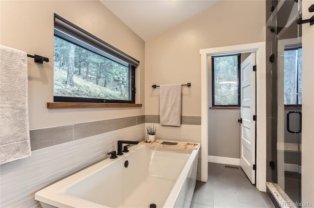 795 Pine Brook Rd, Boulder, CO 80304 - full bath with lofted ceiling, a garden tub, a shower stall, and tile patterned floors