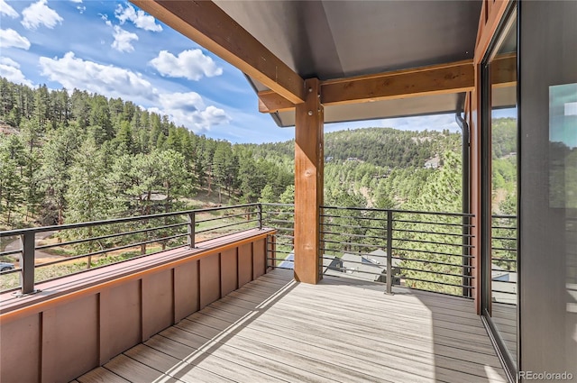 795 Pine Brook Rd, Boulder, CO 80304 - wooden terrace featuring a wooded view