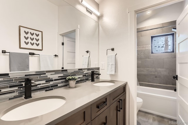 795 Pine Brook Rd, Boulder, CO 80304 - bathroom featuring double vanity, decorative backsplash, toilet, and bathing tub / shower combination