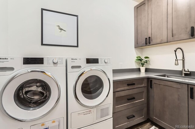 795 Pine Brook Rd, Boulder, CO 80304 - laundry room featuring washer and dryer and cabinet space