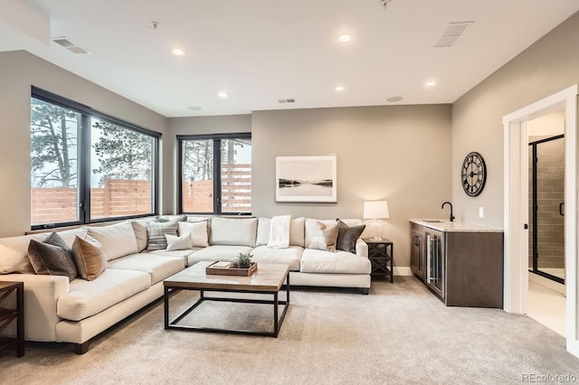 795 Pine Brook Rd, Boulder, CO 80304 - living area featuring bar with sink, light colored carpet, and recessed lighting