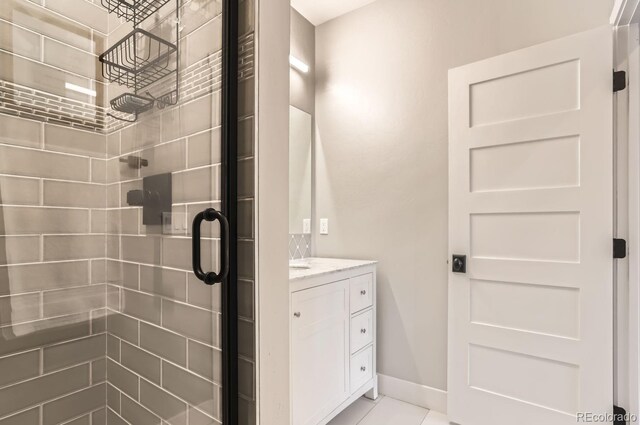 795 Pine Brook Rd, Boulder, CO 80304 - full bath with a stall shower, vanity, baseboards, and tile patterned floors