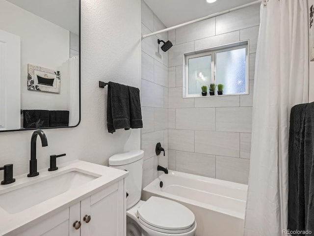 full bath with shower / bath combo, vanity, and toilet