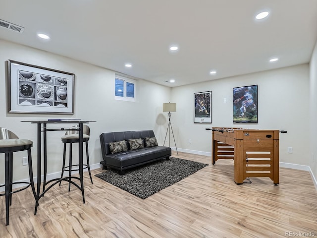 interior space with recessed lighting, visible vents, light wood-style flooring, and baseboards