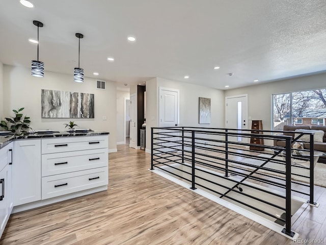 35 Everett St, Lakewood, CO 80226 - corridor featuring an upstairs landing, light wood finished floors, recessed lighting, and baseboards