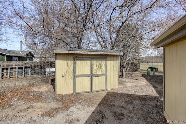 view of shed featuring a fenced backyard