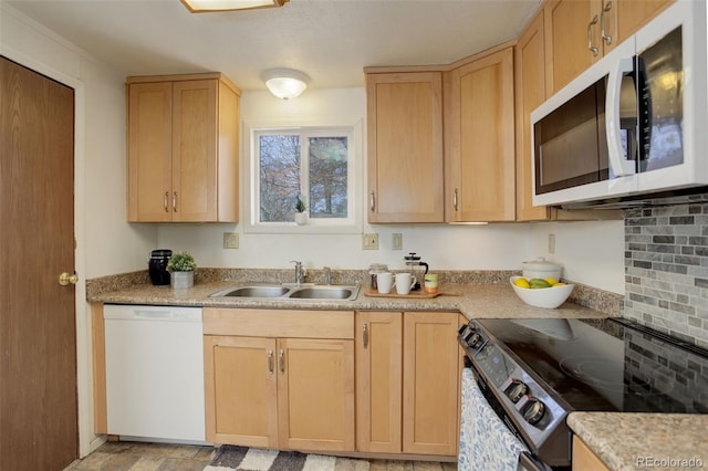 kitchen featuring a sink, white appliances, light brown cabinetry, and light countertops