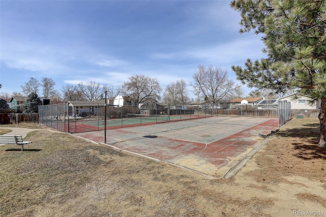 view of tennis court with fence