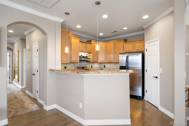 10127 Bluffmont Ln, Lone Tree, CO 80124 - kitchen featuring stainless steel refrigerator with ice dispenser, arched walkways, dark wood-type flooring, backsplash, and light stone countertops