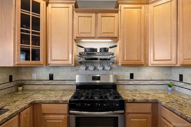 10127 Bluffmont Ln, Lone Tree, CO 80124 - kitchen featuring stainless steel range with gas stovetop, light brown cabinetry, glass insert cabinets, and tasteful backsplash