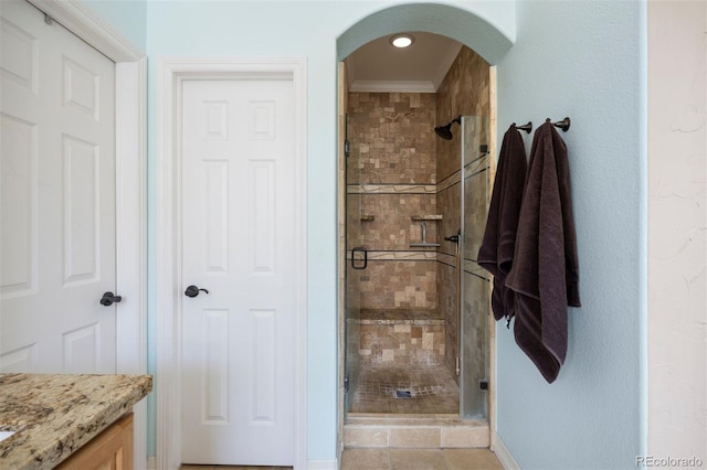 10127 Bluffmont Ln, Lone Tree, CO 80124 - bathroom featuring a stall shower, ornamental molding, and vanity
