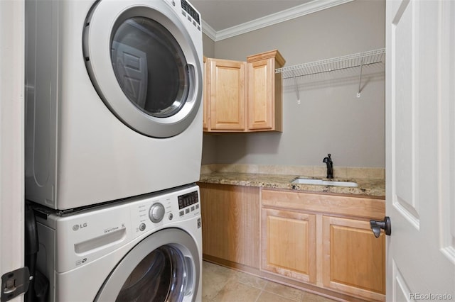 10127 Bluffmont Ln, Lone Tree, CO 80124 - laundry room with stacked washing machine and dryer, cabinet space, crown molding, and light tile patterned floors
